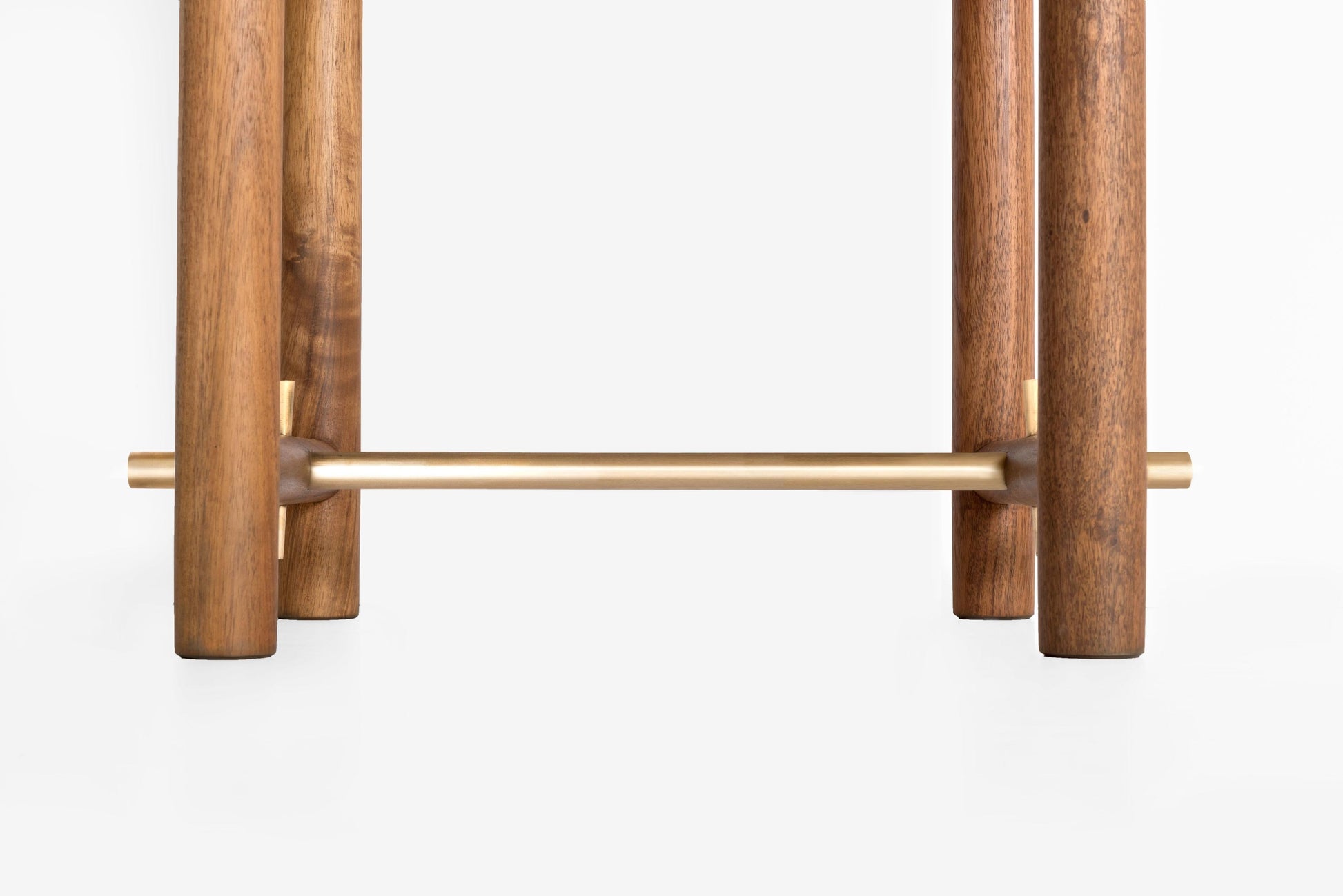 Wooden and brass towel rack on a white background
