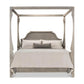 Wooden canopy bed with bedding on a white background