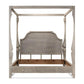Wooden canopy bed with a rustic finish on a white background
