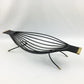 Black metal hammock-like chair on a white background