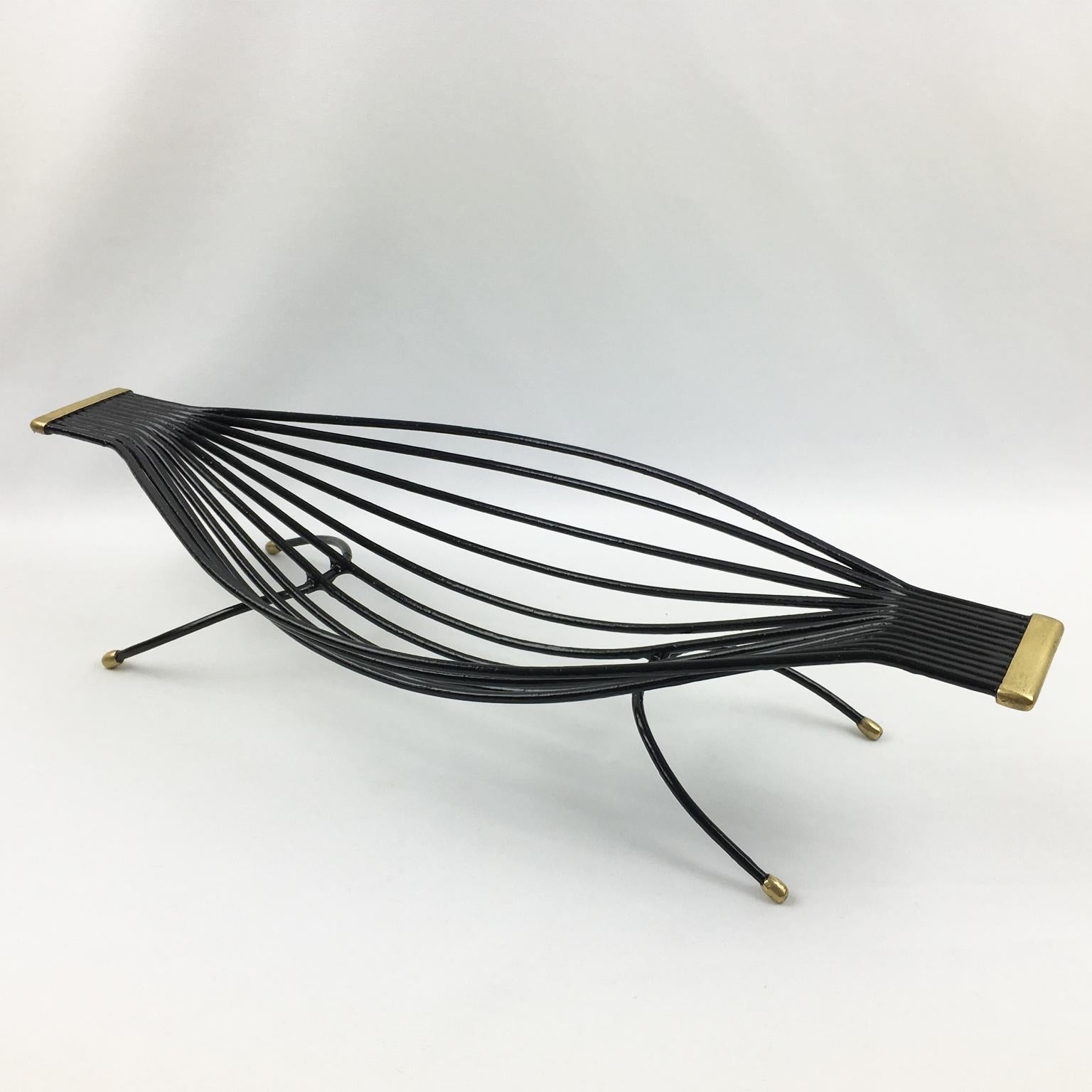 Black metal hammock-like chair on a white background