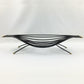Black metal coffee table with gold accents on a white background