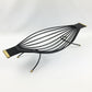 Black wire hammock with gold accents on a white background