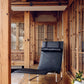 Black leather chair in a wooden interior setting