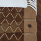 Close-up of a woven wooden chair with rope detailing