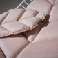 Close-up of a pink cushion with quilted pattern