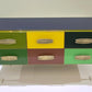 Multicolored cabinet with geometric design on a white background
