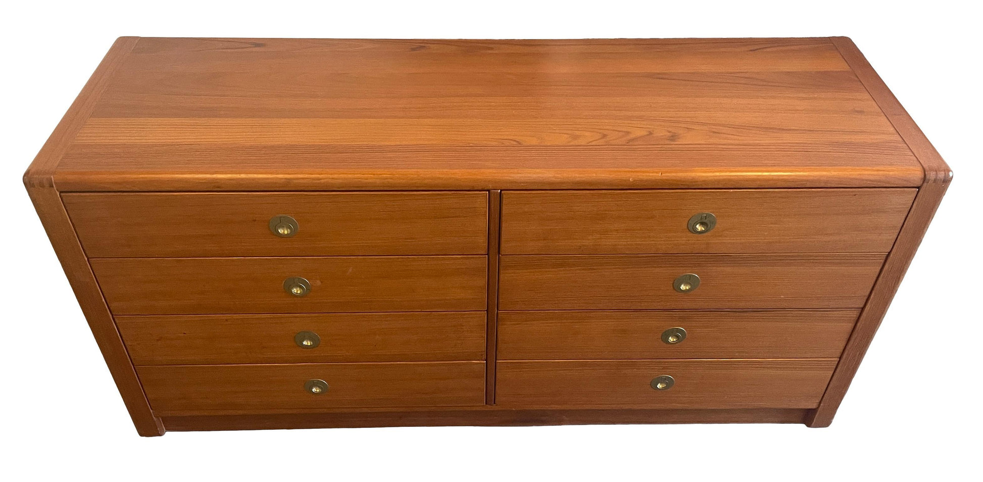 Wooden dresser with four drawers on a white background