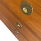 Close-up of a wooden door with brass deadbolt and lock