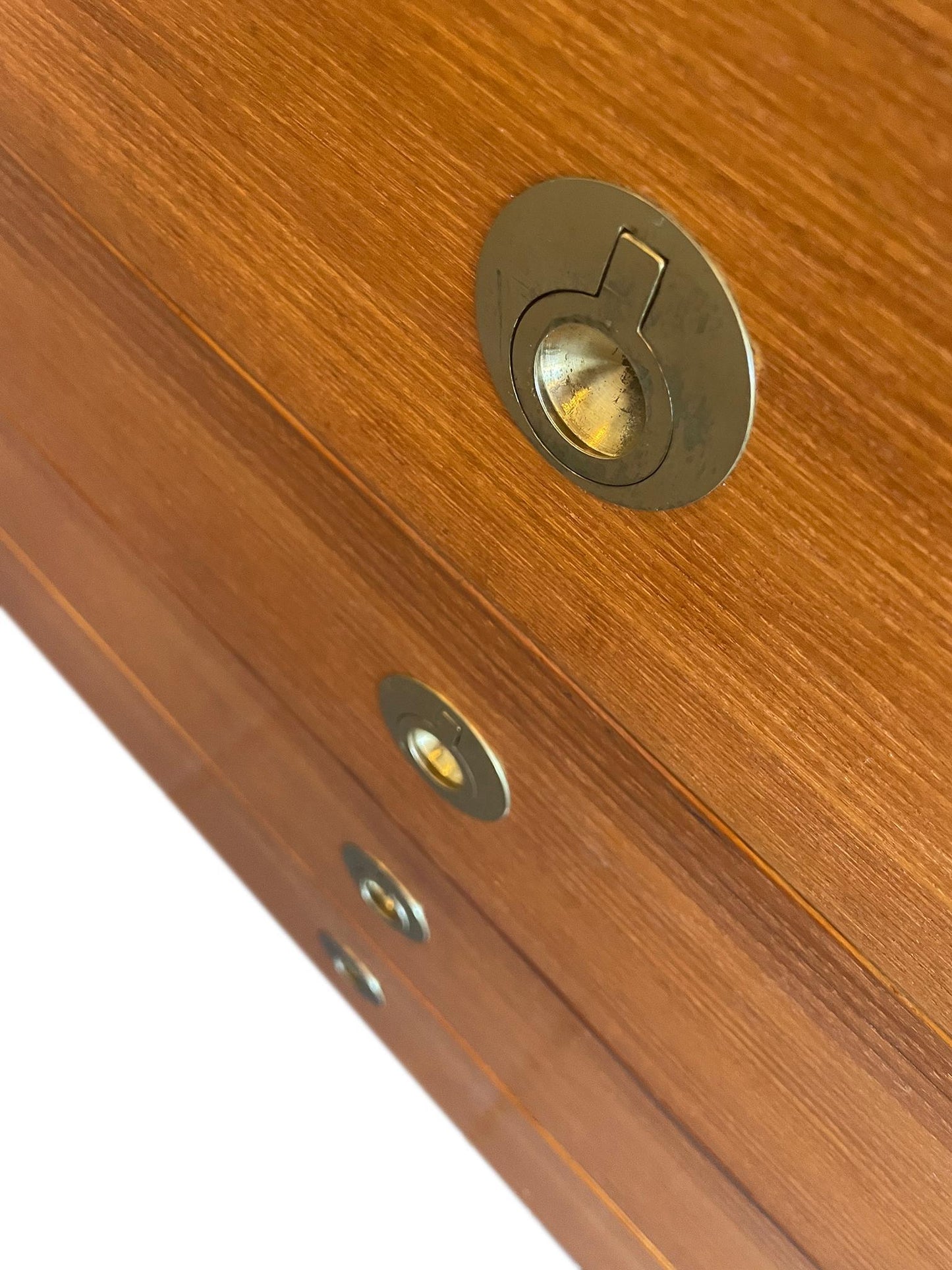 Close-up of a wooden door with brass deadbolt and lock