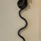 Pair of electrified Serpent Sconces finish in a gunmetal wrought iron finish