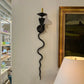 Pair of electrified Serpent Sconces finish in a gunmetal wrought iron finish