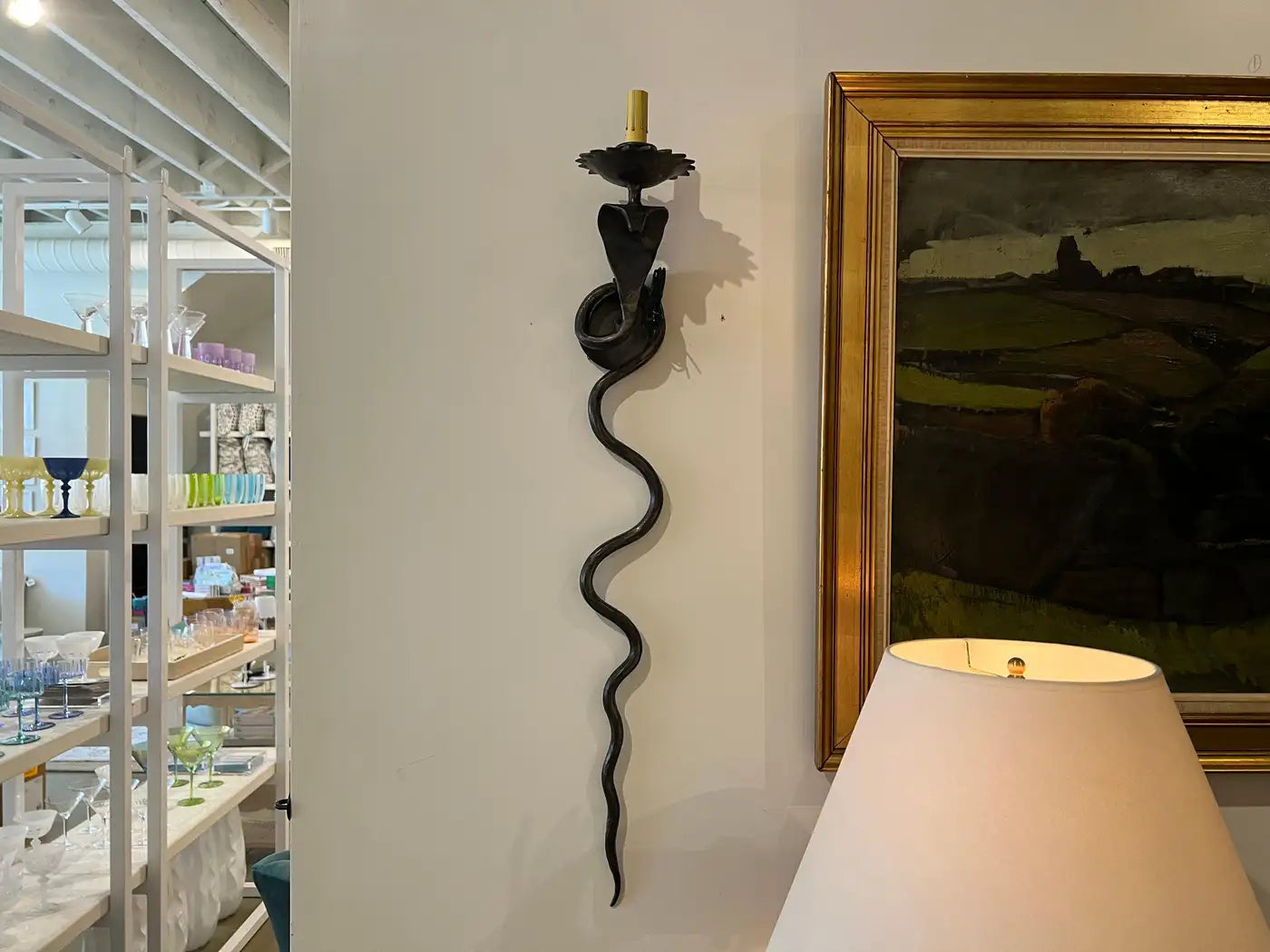 Pair of electrified Serpent Sconces finish in a gunmetal wrought iron finish