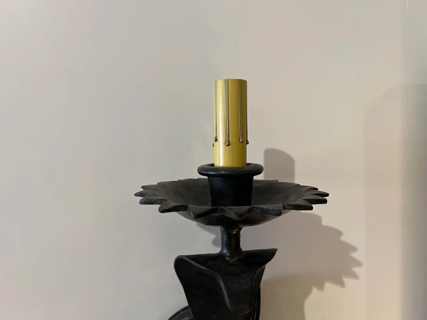 Pair of electrified Serpent Sconces finish in a gunmetal wrought iron finish