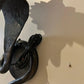 Pair of electrified Serpent Sconces finish in a gunmetal wrought iron finish