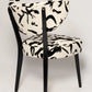 Chair with black and white abstract pattern on a light gray background