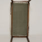 Vintage-style screen with wooden frame and green fabric on a white background