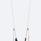 Black woven swing with beige chains on a white background