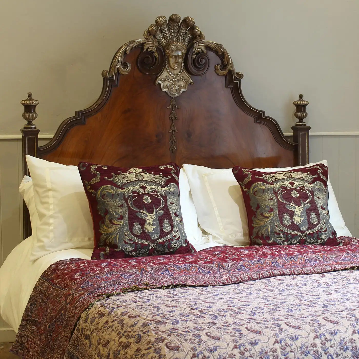 Decorative bed with ornate headboard and patterned bedding