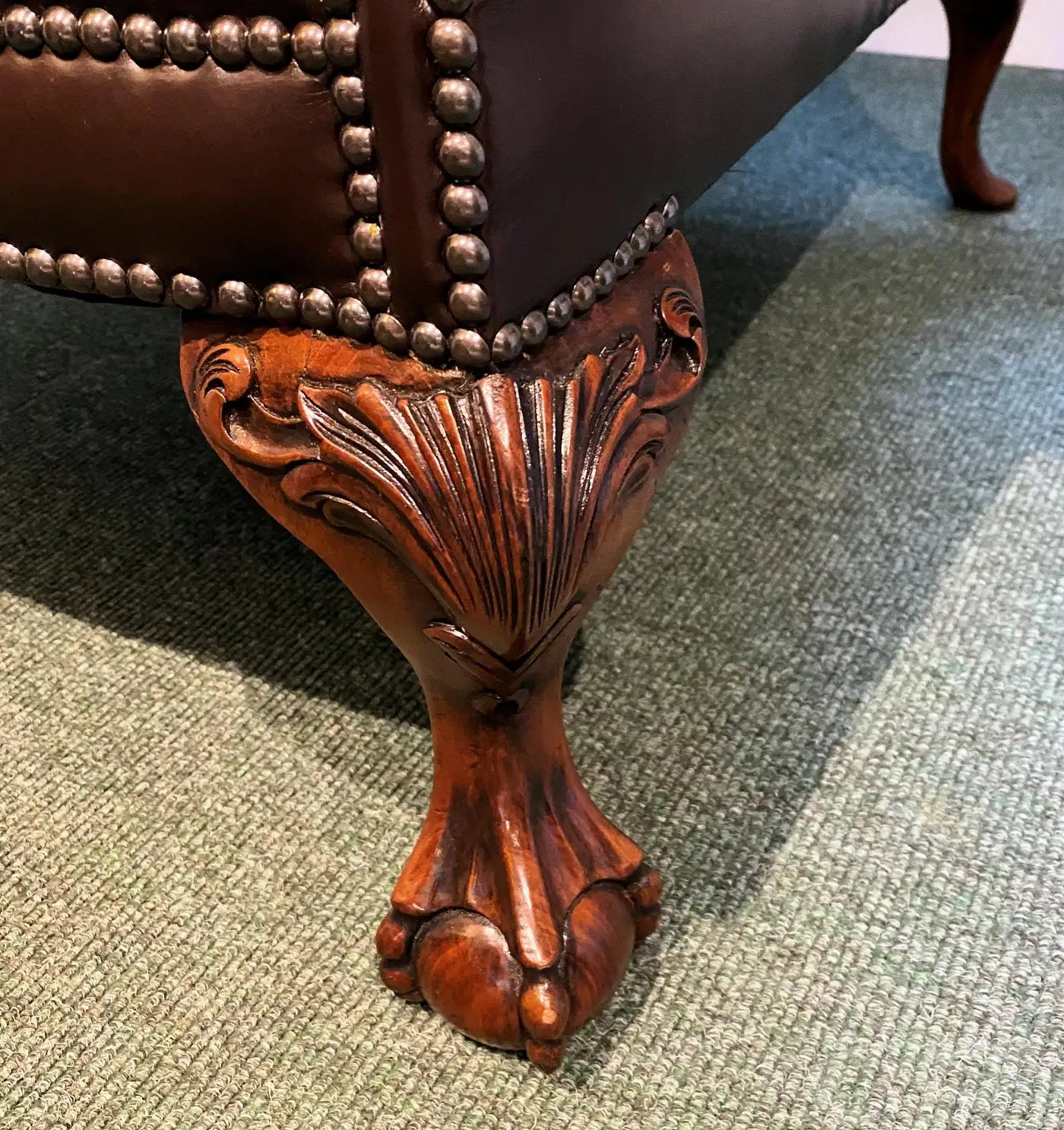 Oversized English Leather Wing Armchair with Mahogany Ball and Claw Legs