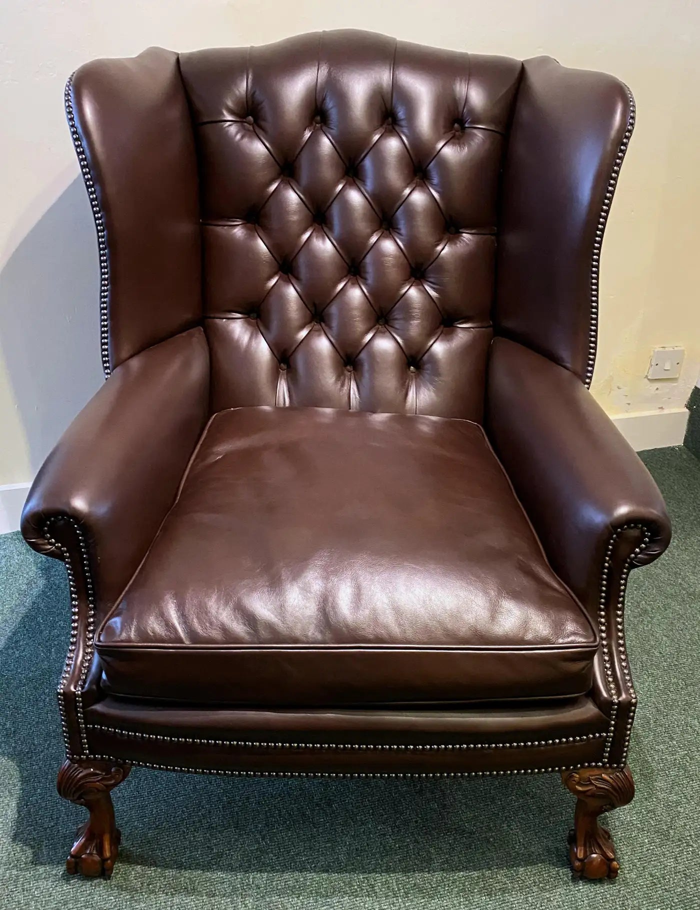 Oversized English Leather Wing Armchair with Mahogany Ball and Claw Legs