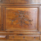 Wooden panel with floral carvings and intricate details