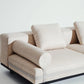 Beige sectional sofa on a white background
