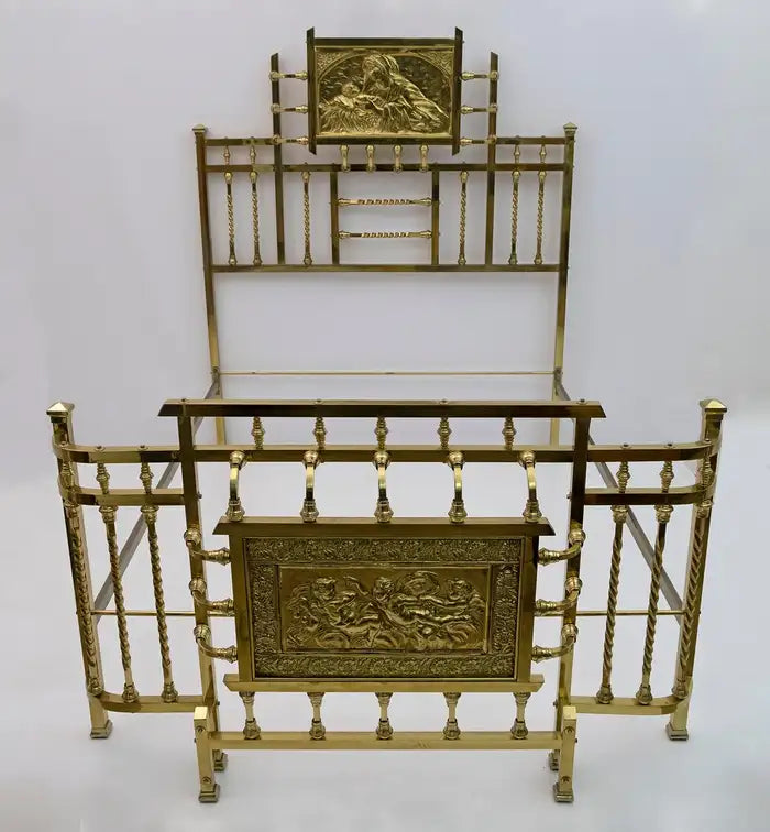 Decorative gold metal shelf with intricate designs on a white background