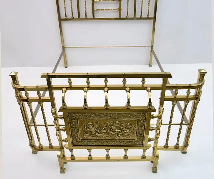 Decorative gold metal stand with intricate designs on a white background