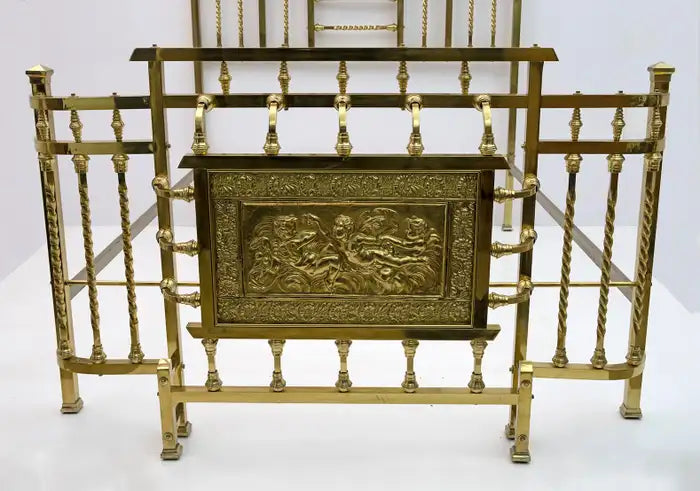 Decorative gold metal stand with intricate design on a white background