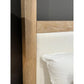 Close-up of a wooden cabinet with glass panel and white interior.