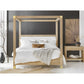 Wooden canopy bed with white bedding in a bedroom setting.