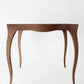Wooden side table with a textured surface on a white background
