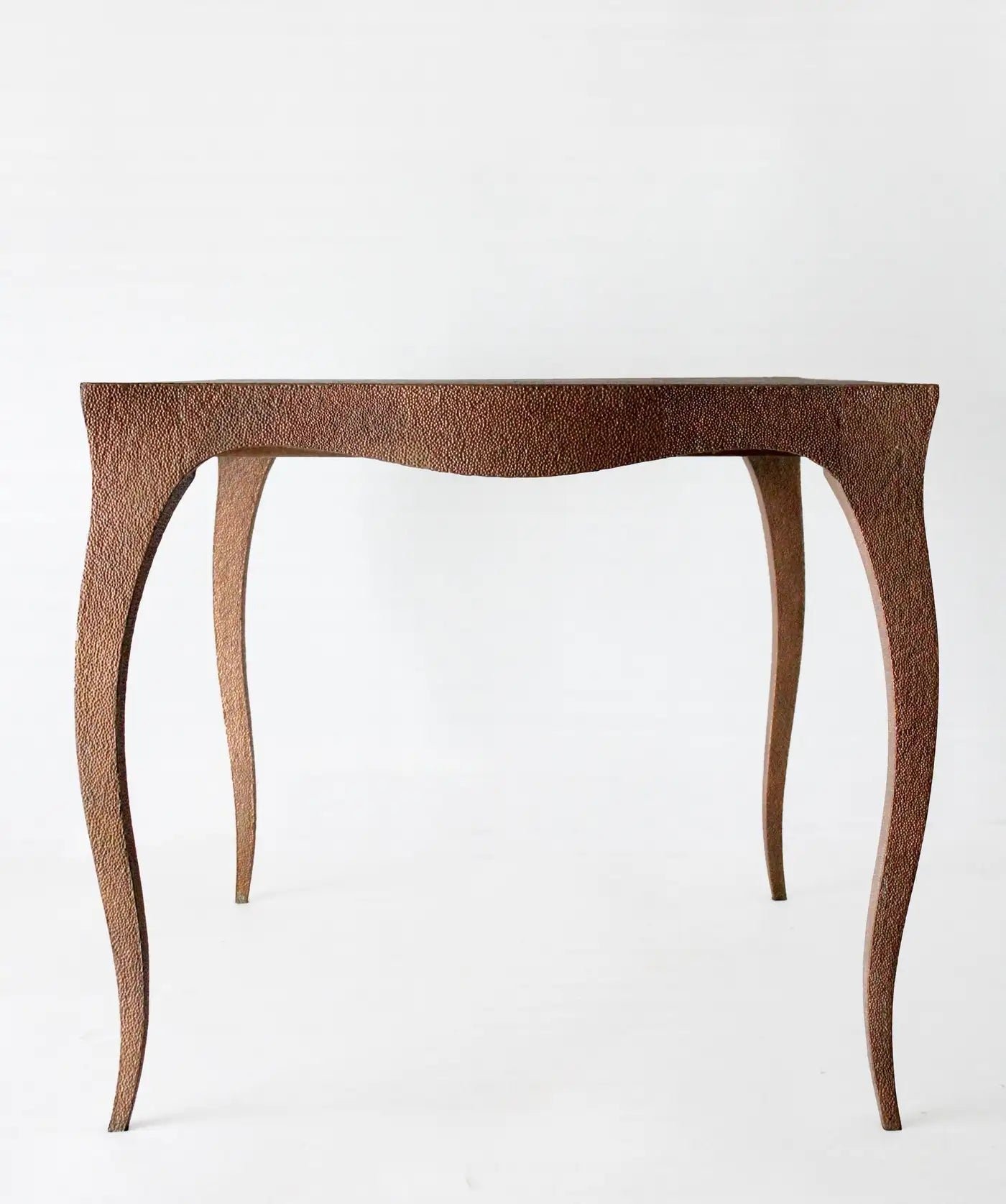 Wooden side table with a textured surface on a white background