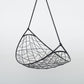 Black woven hanging chair on a light gray background