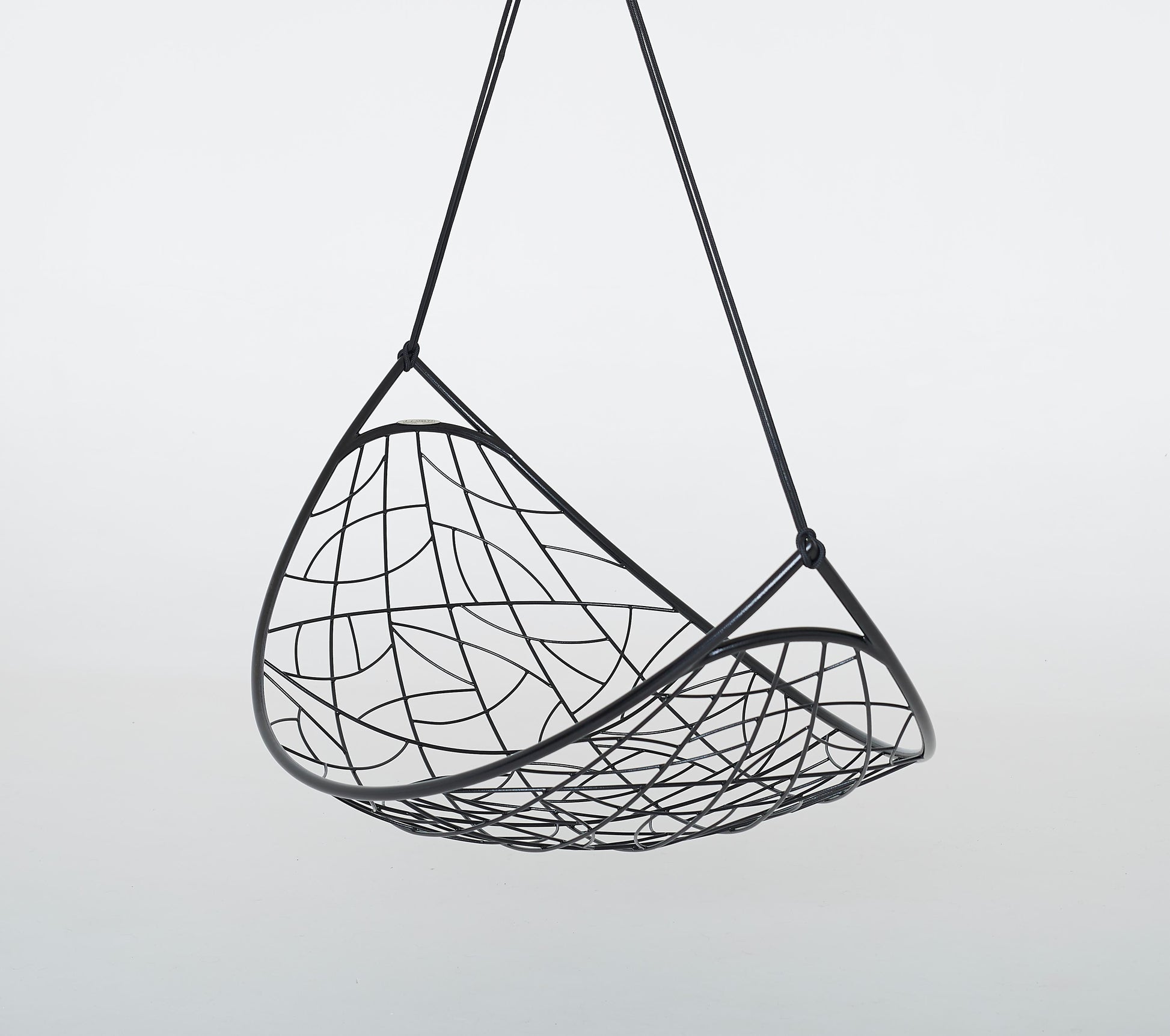Black woven hanging chair on a light gray background