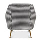 Chair with houndstooth pattern and gold legs on a white background