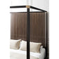 Bed with a wooden headboard in a bedroom setting