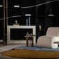 Modern living room with a textured armchair, coffee table, and decorative items.