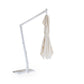White umbrella stand with a beige umbrella on a white background