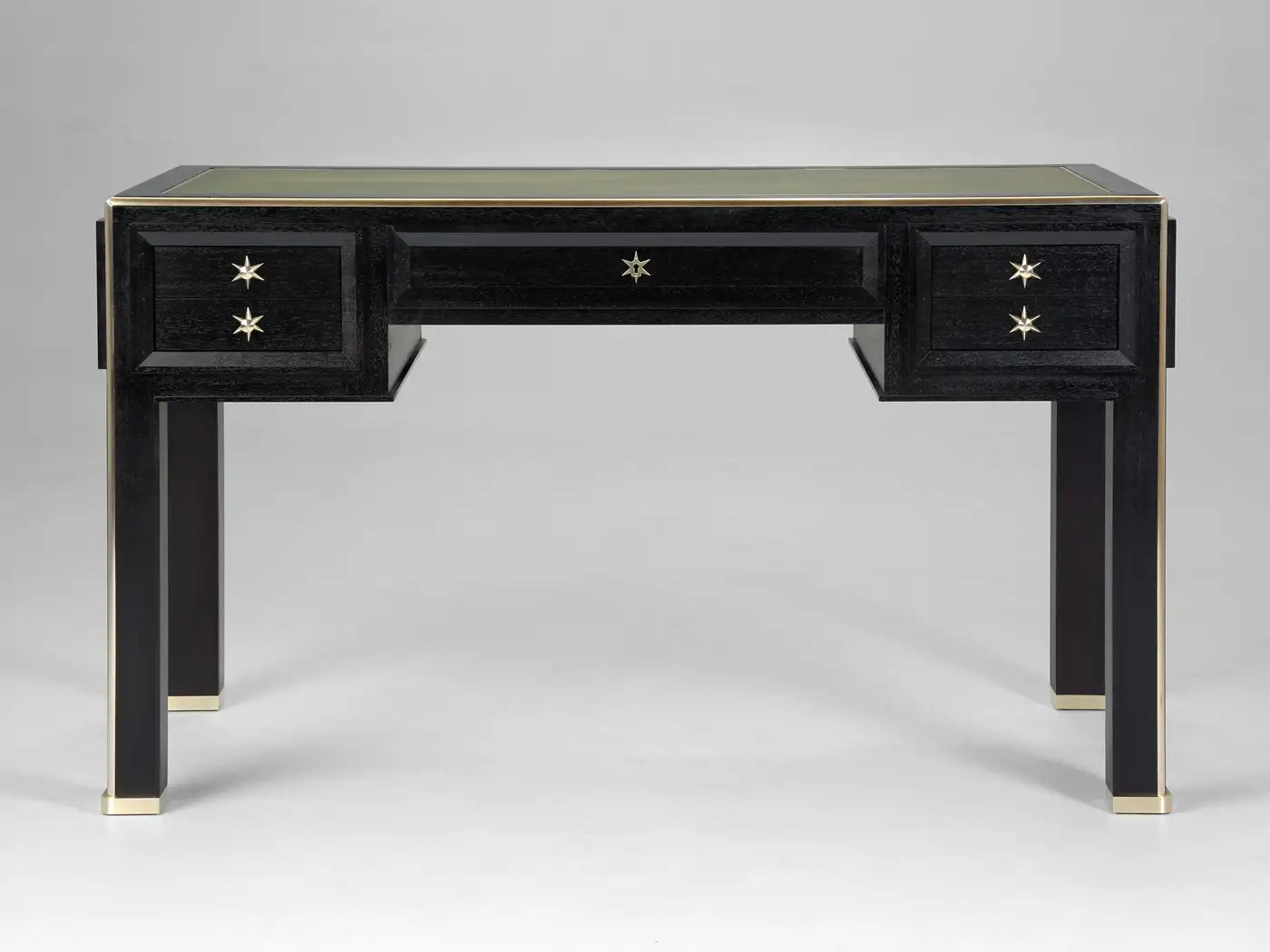 Black desk with gold accents on a gray background