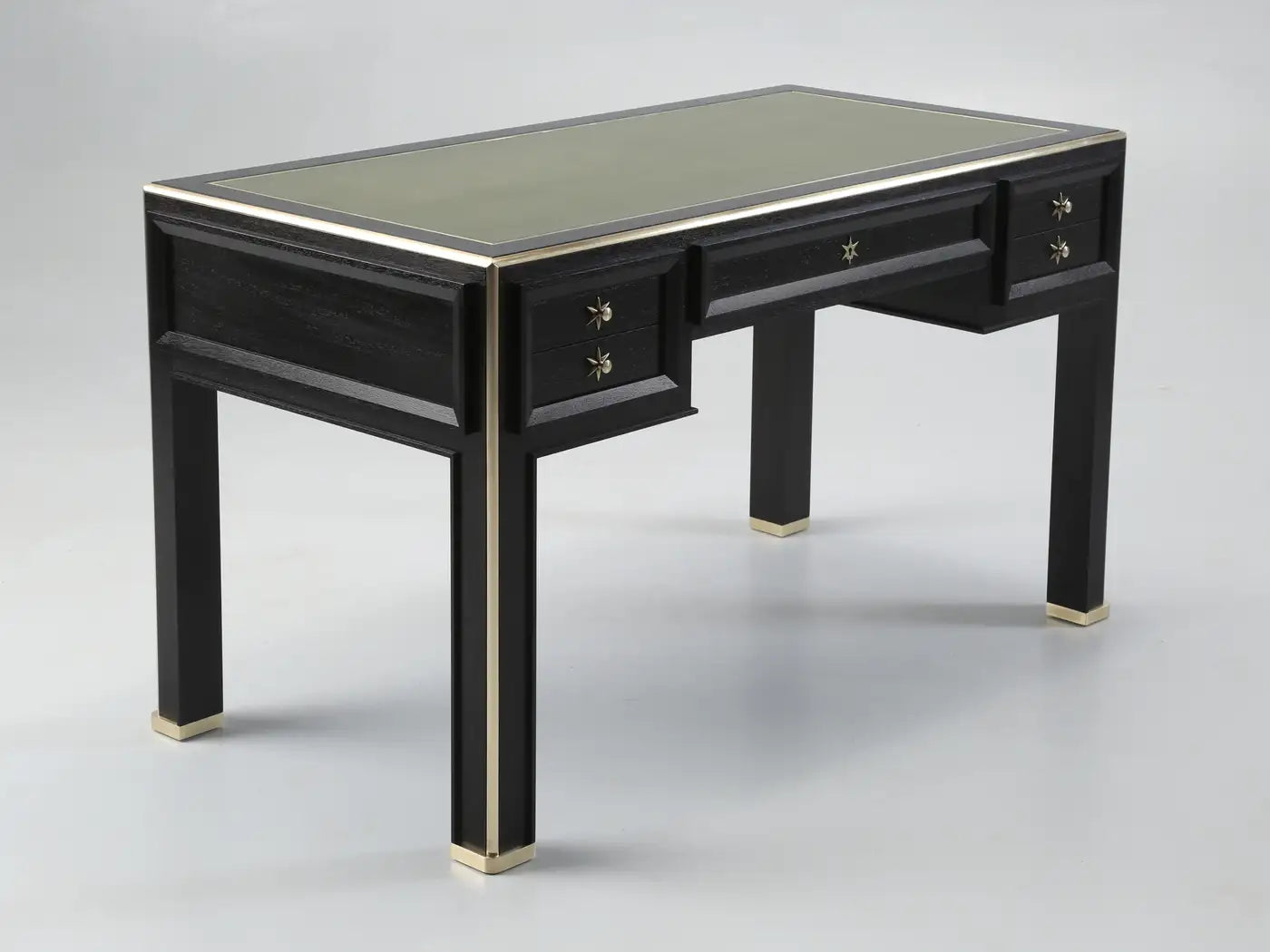 Black desk with glass top on a gray background