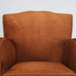 Brown armchair on a light gray background