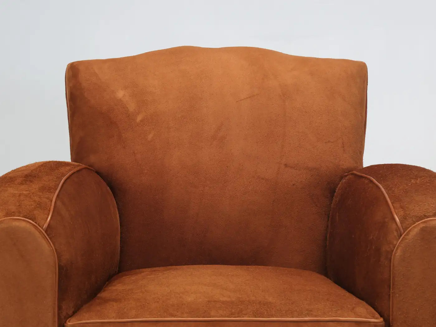 Brown armchair on a light gray background