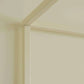 Close-up of a corner where two beige walls meet.