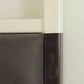 Close-up of a cabinet with a white frame and dark interior.