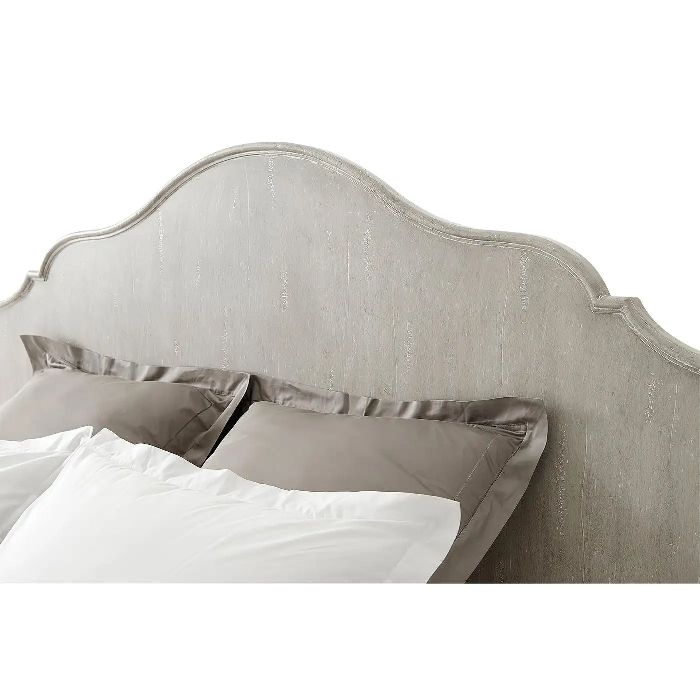 Beige upholstered headboard with pillows on a white background