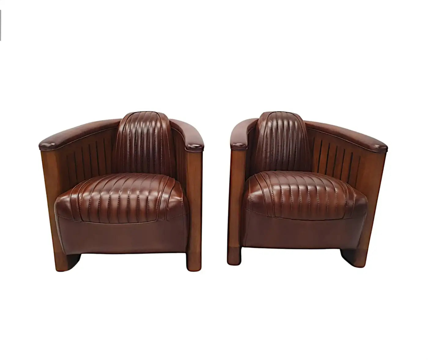 Pair of brown leather armchairs on a white background