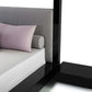 Modern bed with gray headboard and black nightstand on a white background
