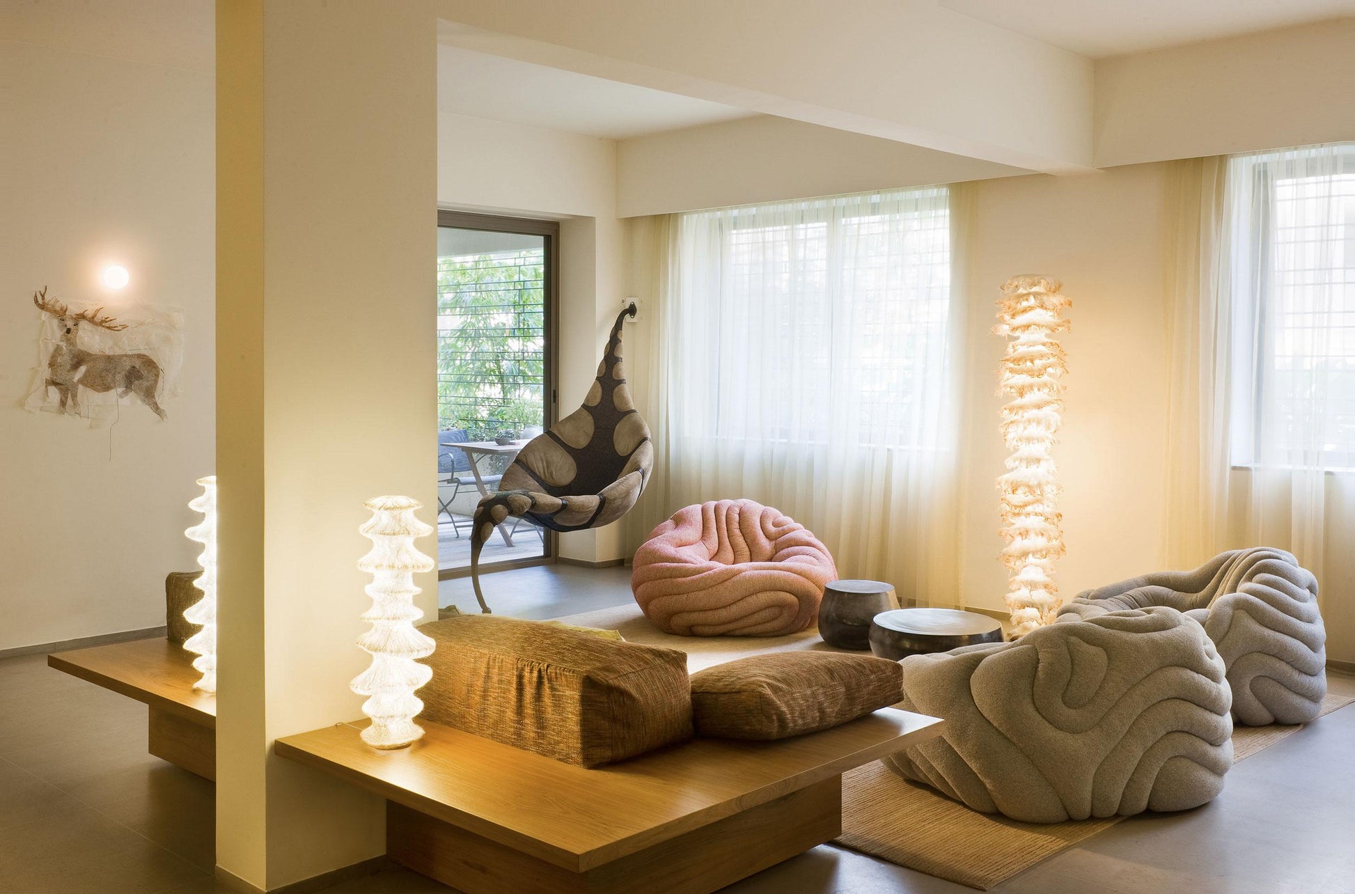 Modern living room with plush furniture and decorative elements